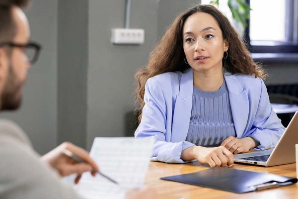elegant-pretty-financier-talking-to-colleague-M5SLY45.jpg